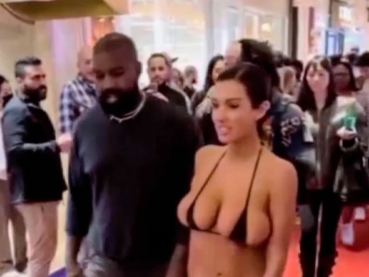 Bianca Censori dons tiny bikini top and goes barefoot with husband Kanye  West - Mirror Online