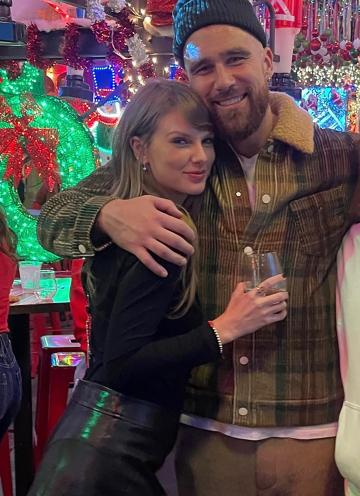 Travis Kelce holds Taylor Swift close in another cuddly pic from post-game  holiday party