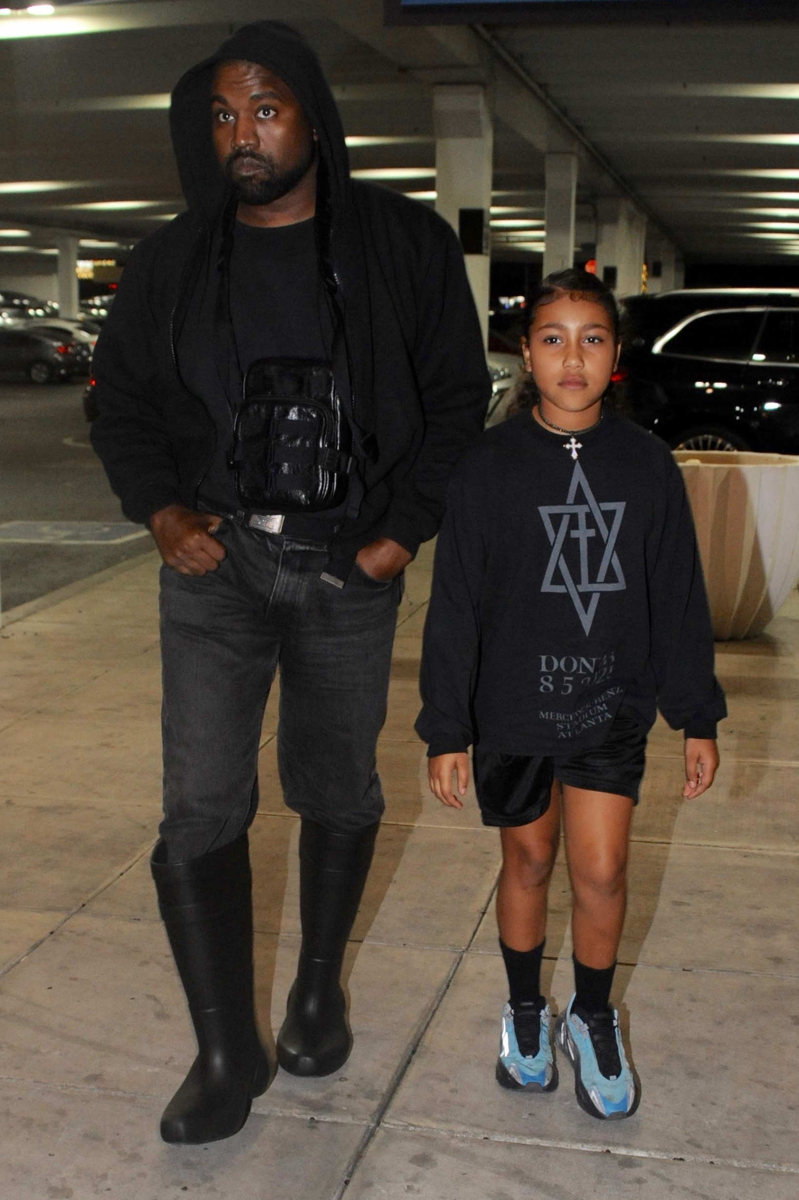 Kanye West and North West walking together 