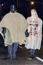 Bianca Censori Wears Clear Raincoat with Kanye West -