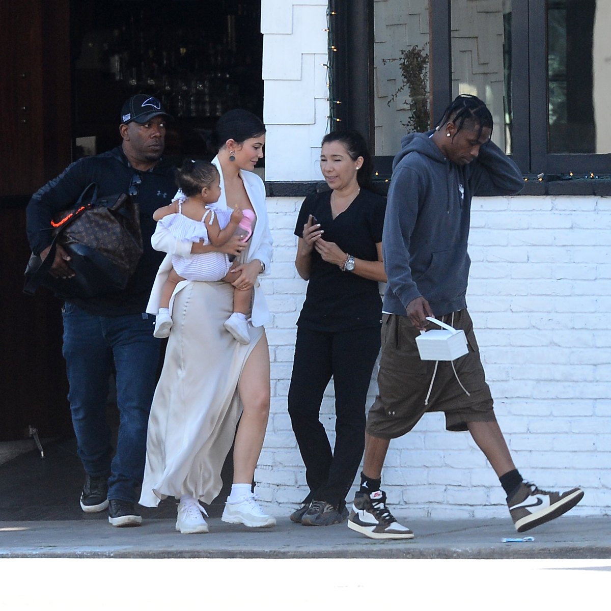 Travis Scott Looks Angry Walking Ahead of Kylie Jenner and Stormi | In  Touch Weekly