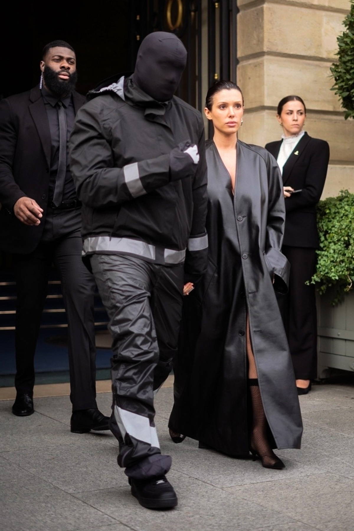 Bianca Censori covers up in a floor-length leather coat while spotted  outside the Ritz Paris with Kanye West in Paris, France-280224_3