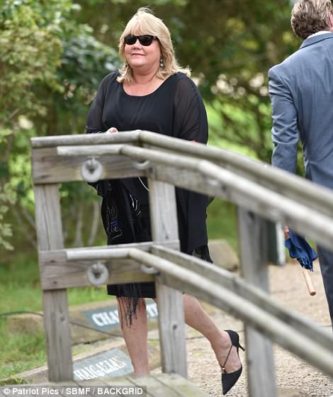 Supportive: Having been friends throughout their school years, Taylor's mother Andrea also attended the nuptials in a black knee-length frock and matching shawl