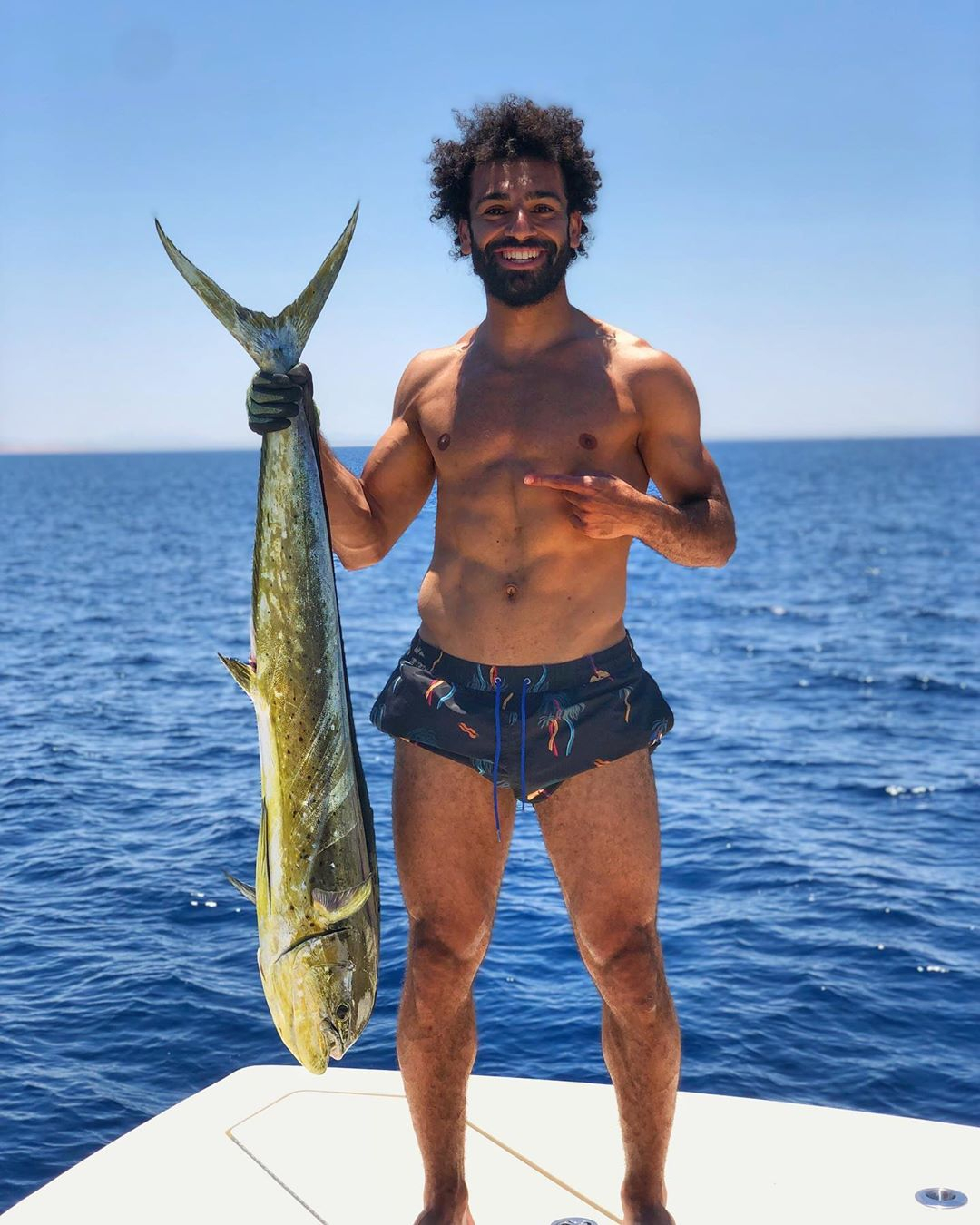 Liverpool's Mo Salah catches another big fish as Egyptian relaxes after  Champions League glory | The Sun