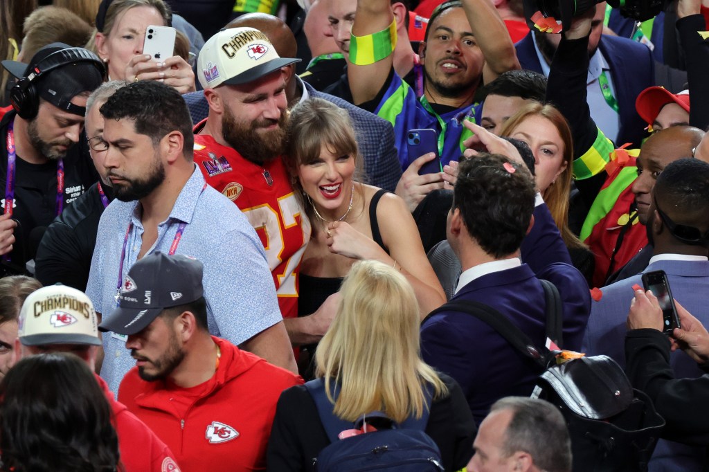 Travis Kelce and Taylor Swift hugging after his 2024 Super Bowl win