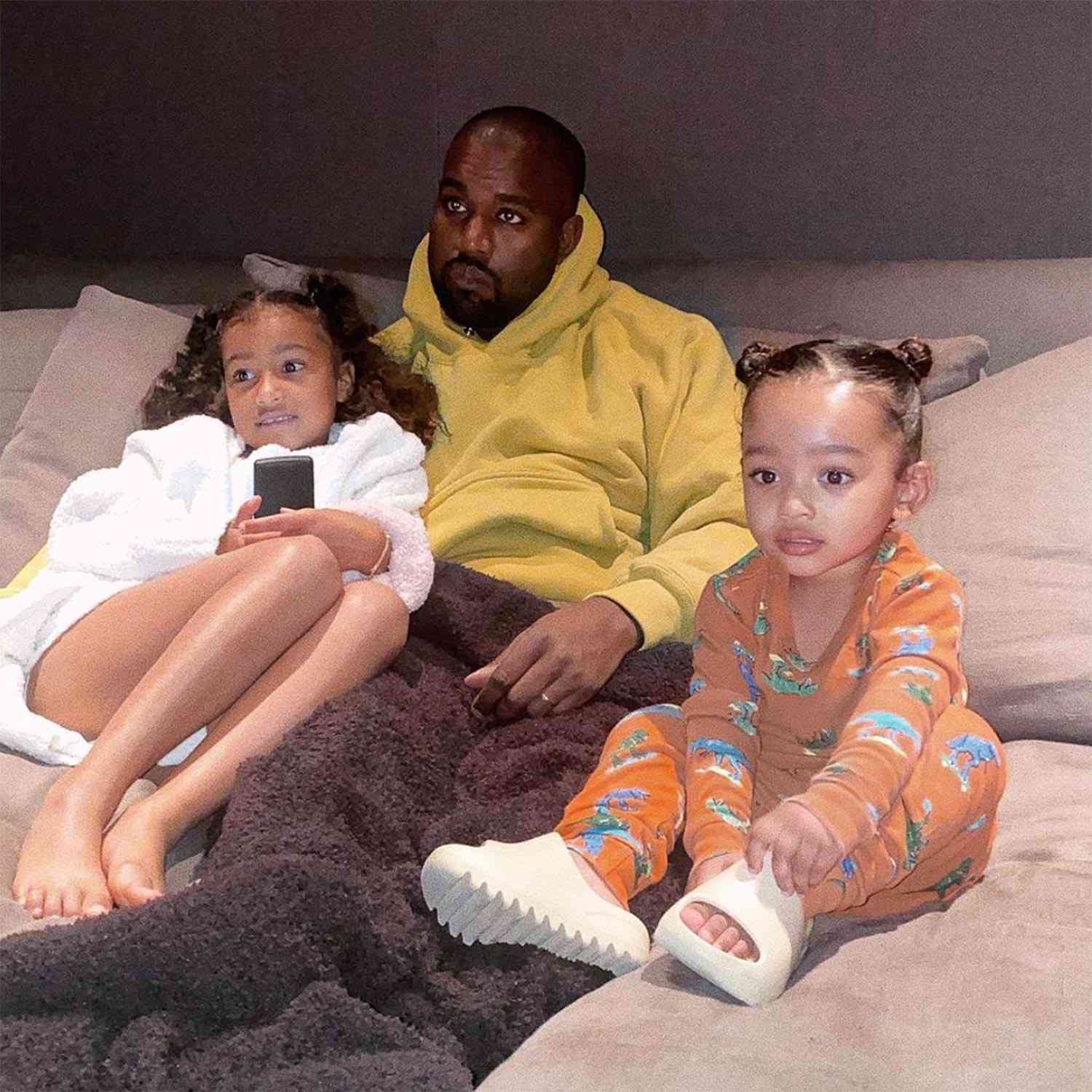 Kanye West Cuddles with Daughters Chicago and North for TV Time