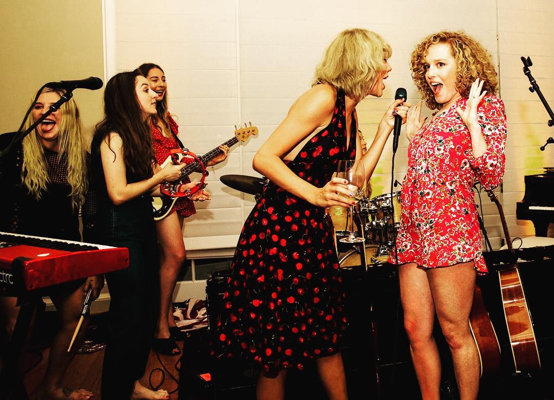 Taylor Swift singing with her friend Abigail.