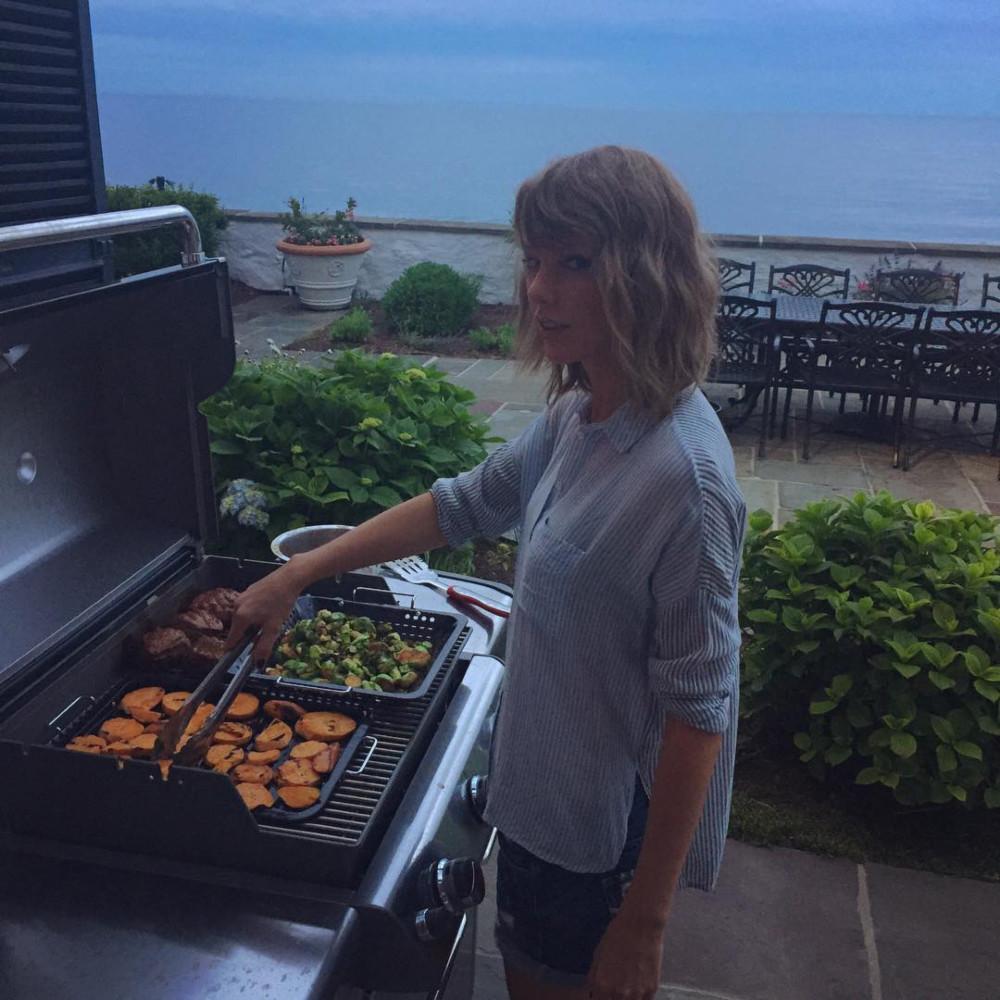 Taylor Swift grilling at her Rhode Island home.
