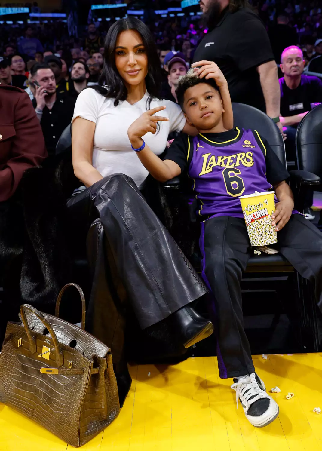 Kim Kardashian and Saint West attend a basketball game between the Los Angeles Lakers and Golden State Warriors at Crypto.com Arena on March 16, 2024