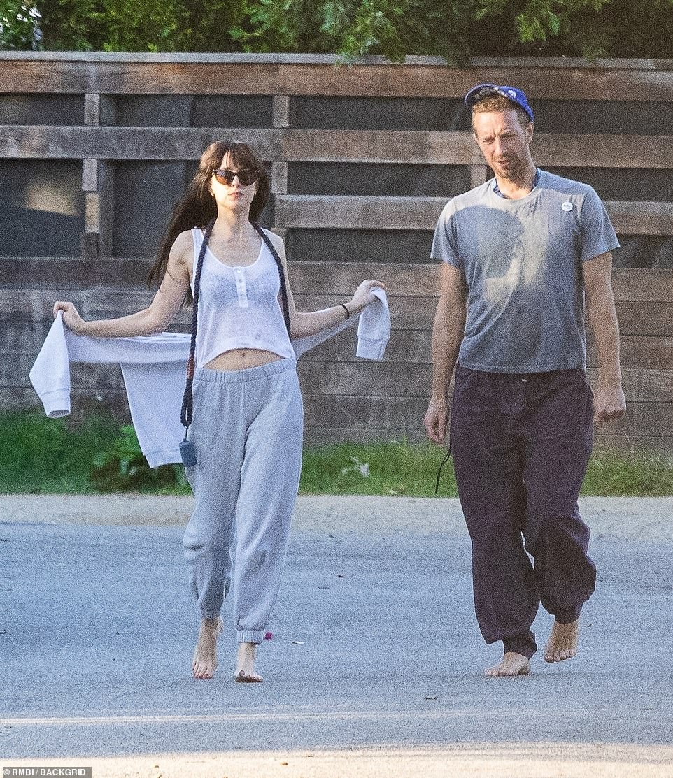 PICTURE EXCLUSIVE: Dakota Johnson wraps arms around boyfriend Chris Martin  | Daily Mail Online