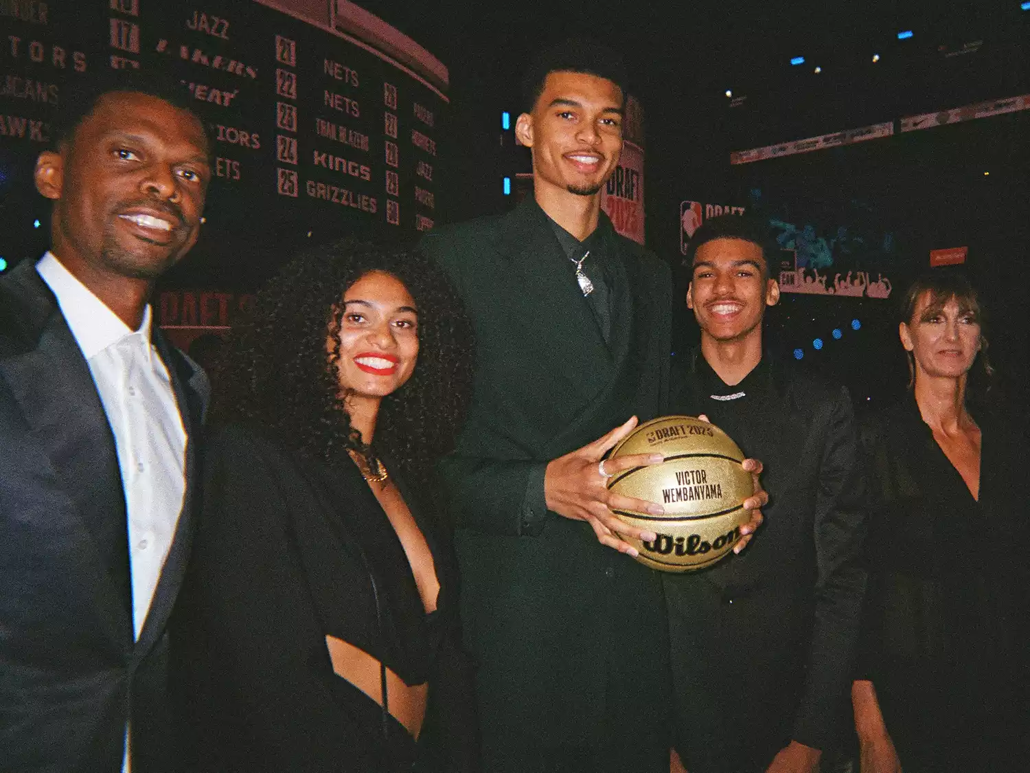 Victor Wembanyama poses for a photograph with family during the 2023 NBA Draft on June 22, 2023 at Barclays Center in Brooklyn, New York. 