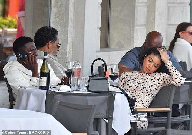 Kevin Hart is glued to his phone during lunch with his wife Eniko in Venice  | Daily Mail Online