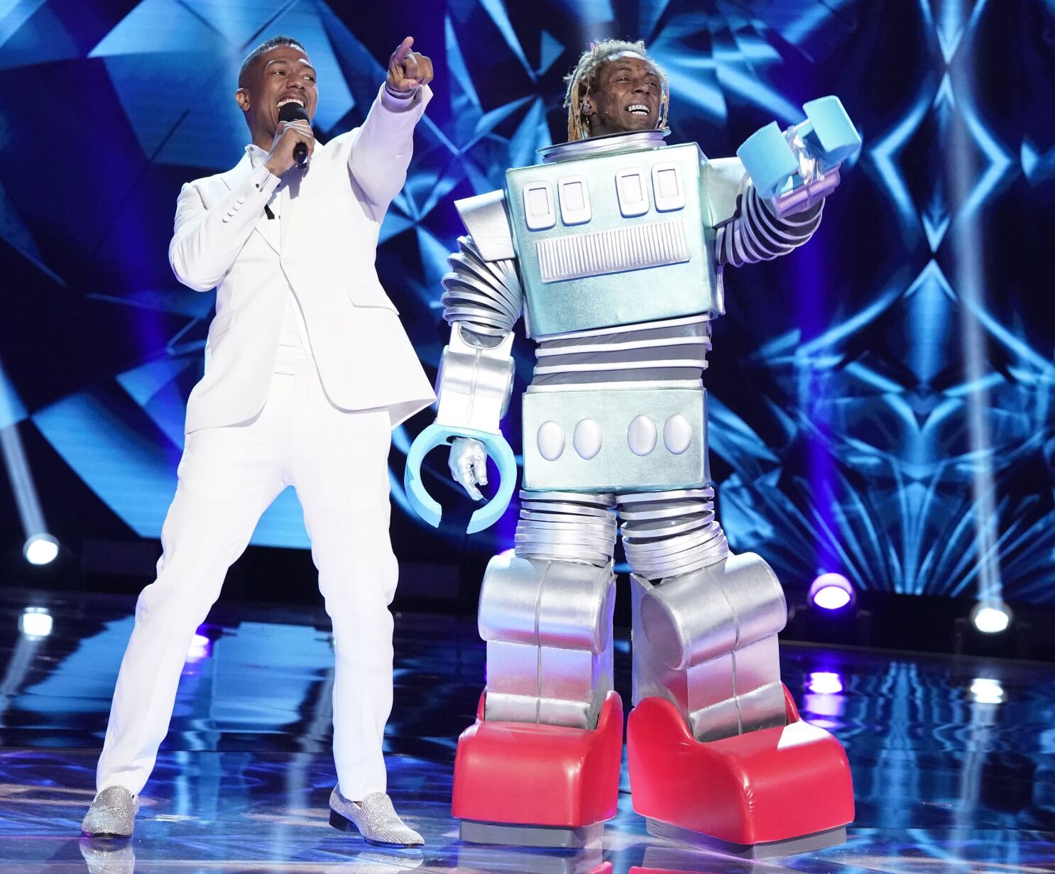 The Masked Singer' season 3: Robot revealed to be 'Funeral' singer Lil Wayne  - Deseret News