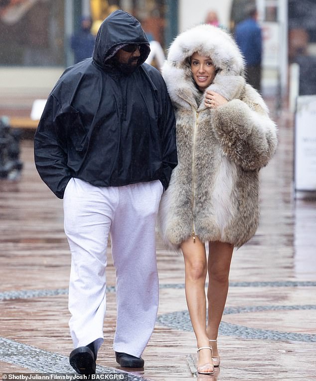 Kanye West's wife Bianca Censori bundles up in luxurious fur coat for rainy  stroll with rapper in Santa Barbara | Daily Mail Online