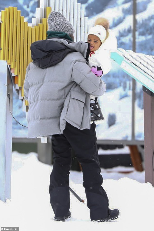 Kevin Hart carries his daughter Kaori, one, before teaching her how to ski  | Daily Mail Online