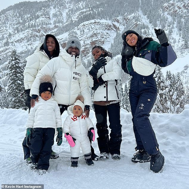 Kevin Hart carries his daughter Kaori, one, before teaching her how to ski  | Daily Mail Online