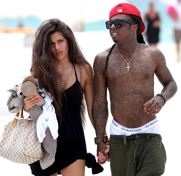 Showing off all his tattoos and most of his Ralph Laurens, Lil Wayne and  his ladyfriend take a stroll down Miami … | Lil wayne, Rihanna photos,  Celebrity beach body