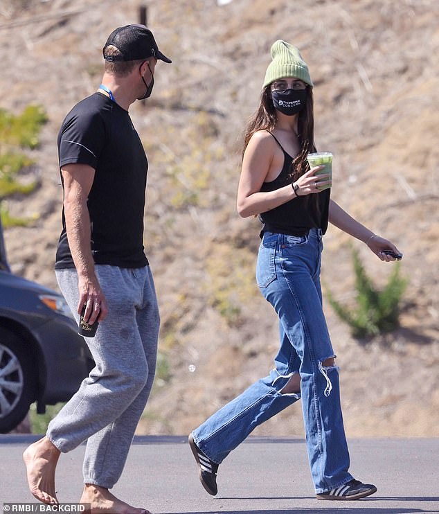 Dakota Johnson steps out with barefoot beau Chris Martin in Malibu | Daily  Mail Online