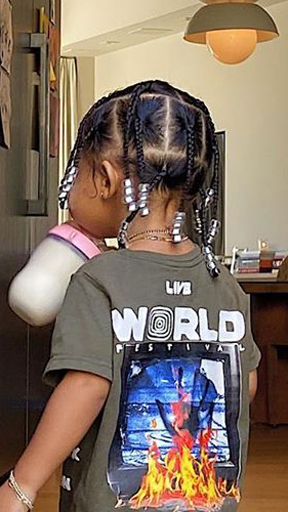 Stormi Webster has her hair styled just like her dad, Travis Scott