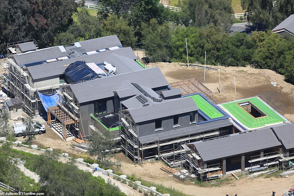 Kylie Jenner will soon be saying 'home sweet home' to her new $15 million mega mansion in Hidden Hills. Aerial sH๏τs of the 26-year-old billionaire's fortress-like mansion taken on Tuesday (pictured) show that construction has nearly finished