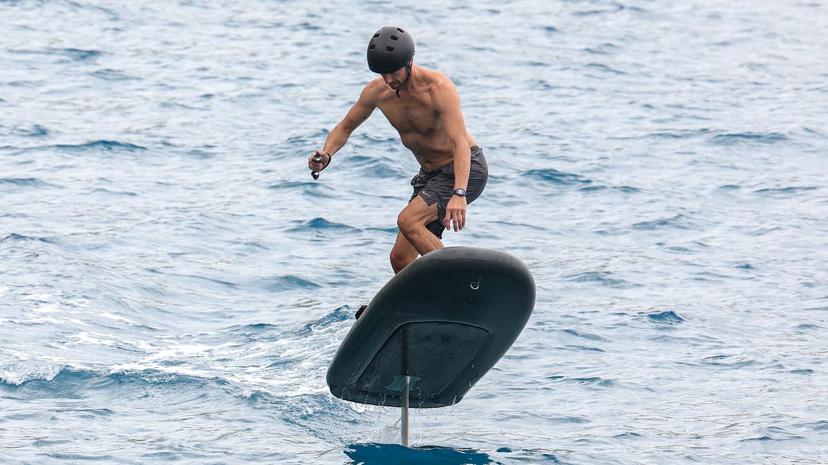 Chris Martin shows off his impressive physique as he enjoys electric  surfing session with son Moses, 17, during trip to Ibiza | Daily Mail Online