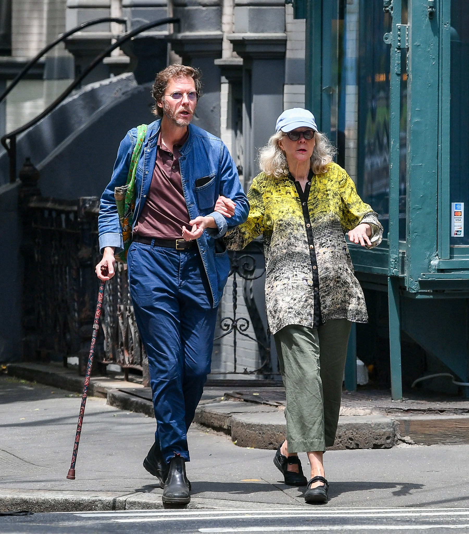 Blythe Danner links arms with son Jake Paltrow on rare outing