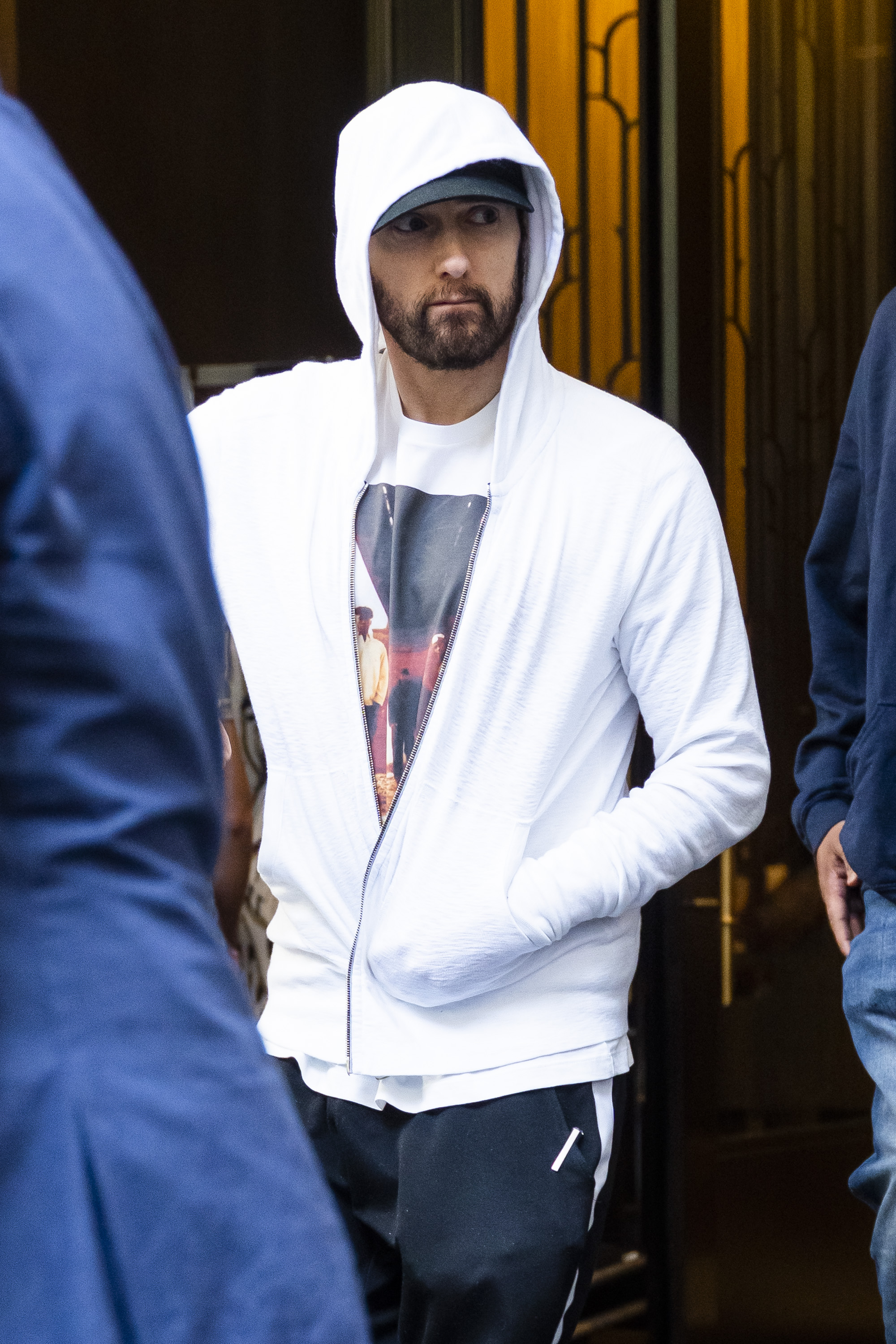 Eminem in a white hoodie.