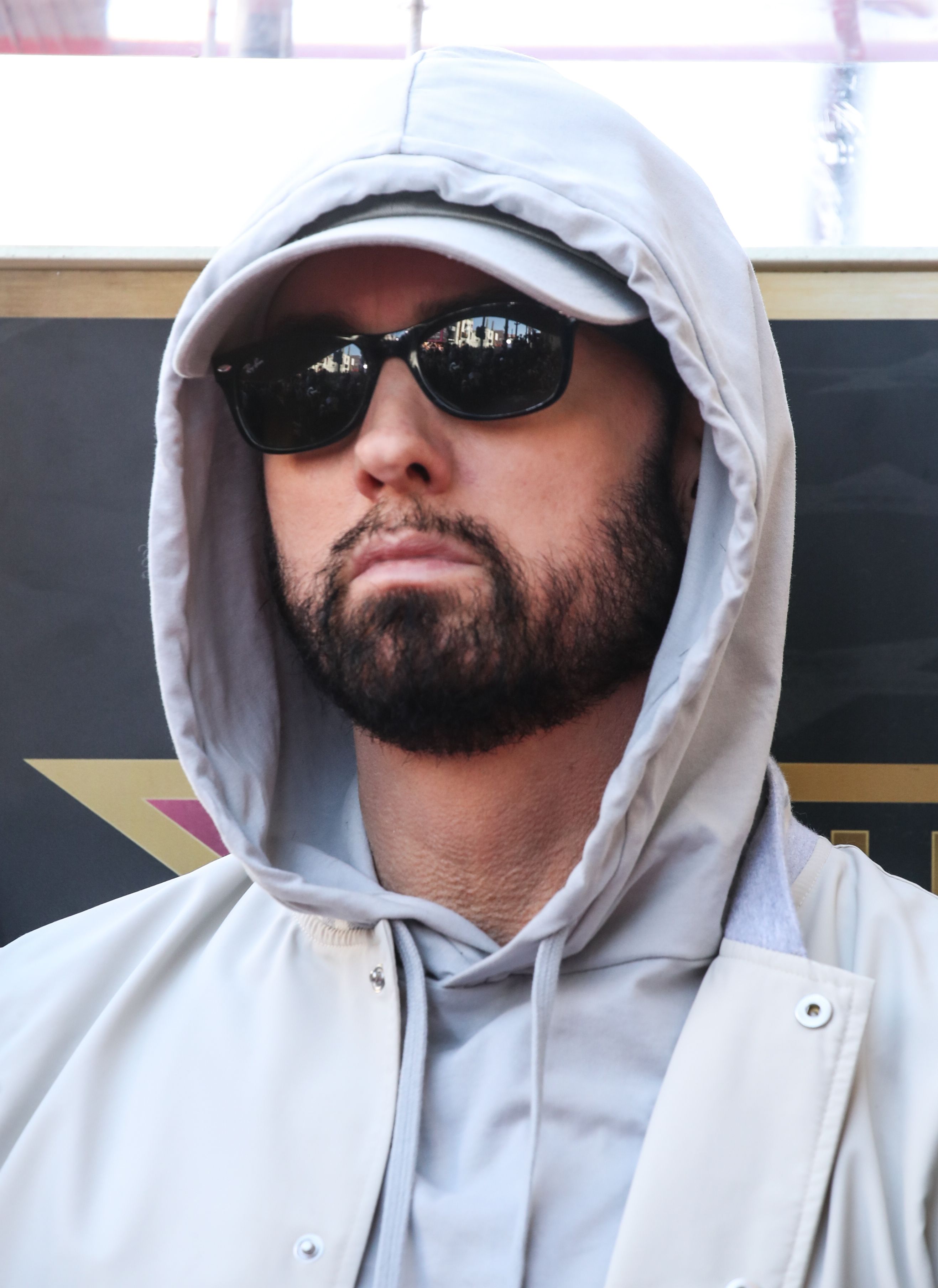 Eminem wearing glasses.