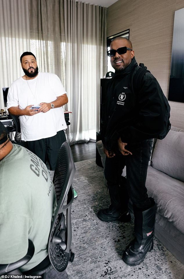 Kanye West flashes big beaming smile as DJ Khaled gifts him a pair of  extremely rare Jordans | Daily Mail Online