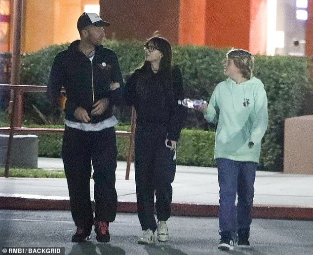 Dakota Johnson proves she'd be the perfect stepmom as she and Chris Martin  take his son to movies | Daily Mail Online