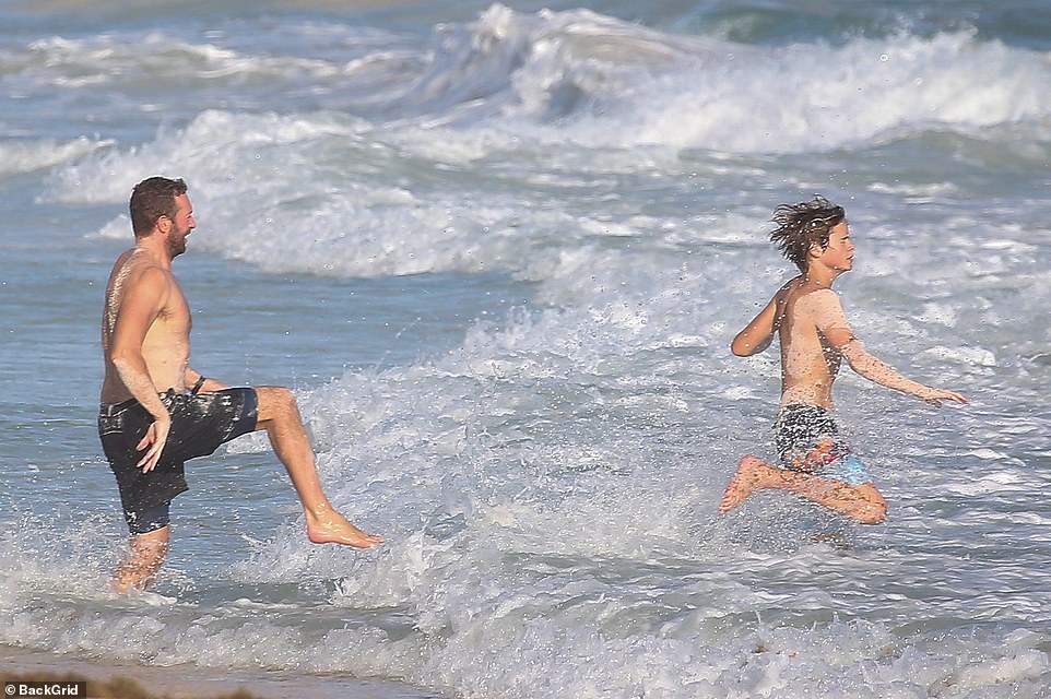 Chris Martin gets a pretend 'punch' to his face by son Moses,15, as they  play fight in Mexico | Daily Mail Online