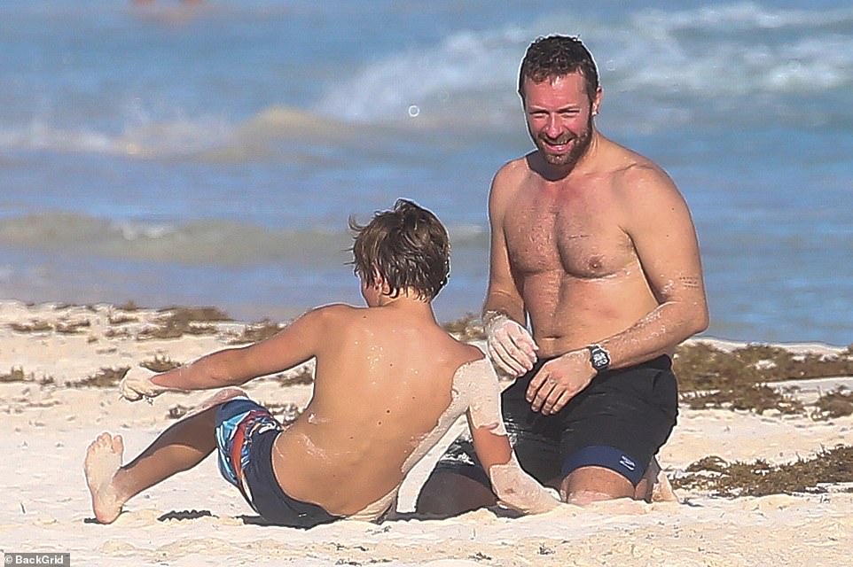 Chris Martin gets a pretend 'punch' to his face by son Moses,15, as they  play fight in Mexico | Daily Mail Online