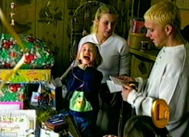 Flashback: Eminem pictured with his ex-wife Kim Scott and Hailie in a home video featured in his 2005 music video for Mockingbird