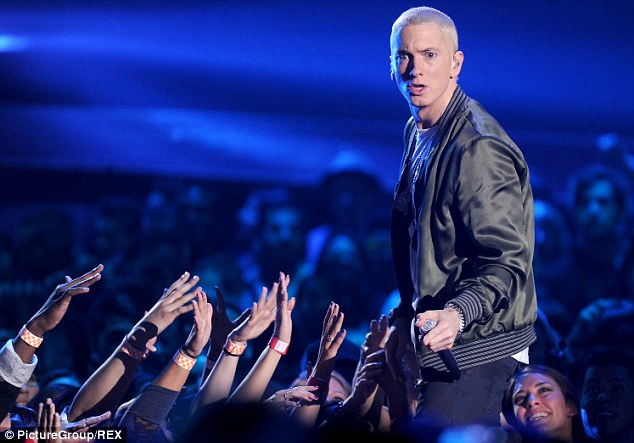 Still going strong: The 41-year-old rapper performing at the MTV Movie Awards in April