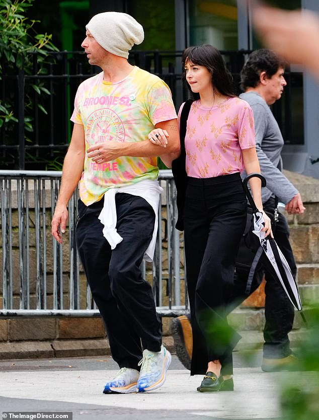 Chris Martin and Dakota Johnson walk arm in arm on a rare public outing  together in New York City | Daily Mail Online