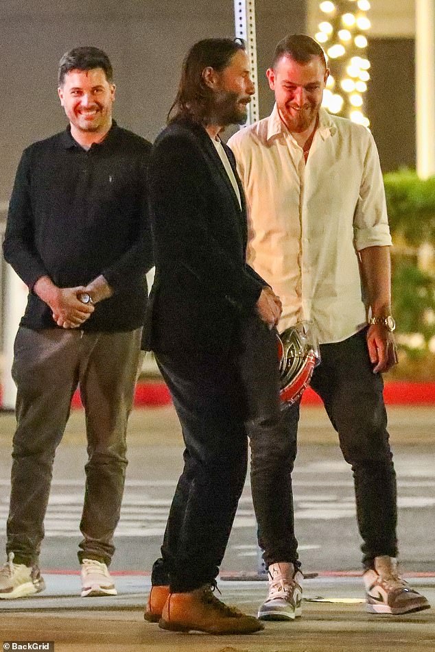 Good times: The actor shares a laugh with his buddies after eating a yummy dinner last night in Beverly Hills