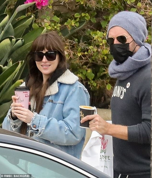 Dakota Johnson and Chris Martin hang with Sean Penn and real estate agent |  Daily Mail Online