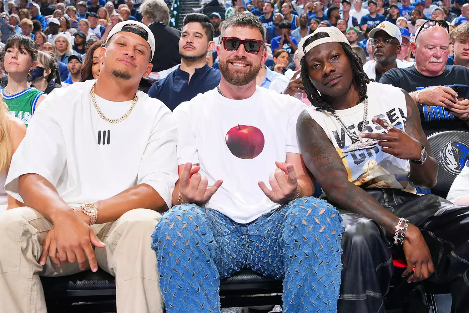 Patrick Mahomes, Travis Kelce, and Marquise Brown sit court side during the game between the Minnesota Timberwolves and the Dallas Mavericks during Game 3 of the Western Conference Finals of the 2024 NBA Playoffs on May 26, 2024 at the American Airlines Center in Dallas, Texas. 