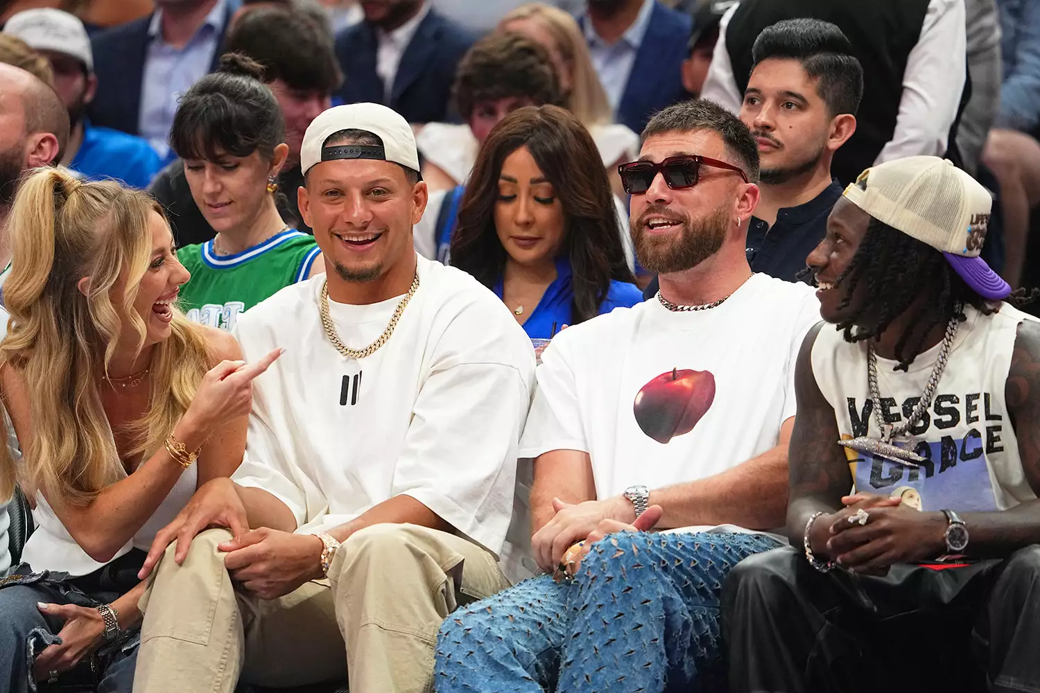 Brittany Mahomes, Patrick Mahomes, Travis Kelce, and Marquise Brown sit court side during the game between the Minnesota Timberwolves and the Dallas Mavericks during Game 3 of the Western Conference Finals of the 2024 NBA Playoffs on May 26, 2024 at the American Airlines Center in Dallas, Texas.