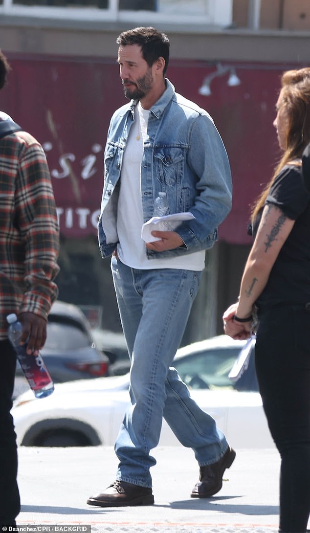 Keanu Reeves looked casual as walked to his trailer rocking a new short haircut