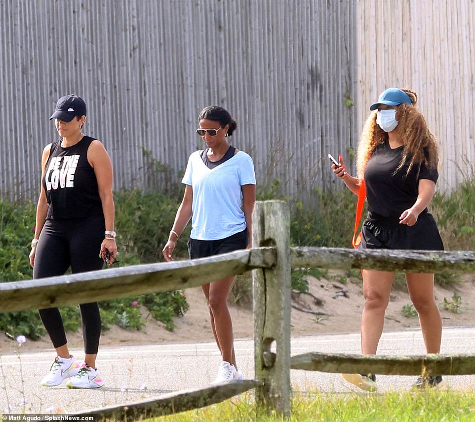 Excursion: The songstress we seen with a couple of pals as they went for a walk to the beach