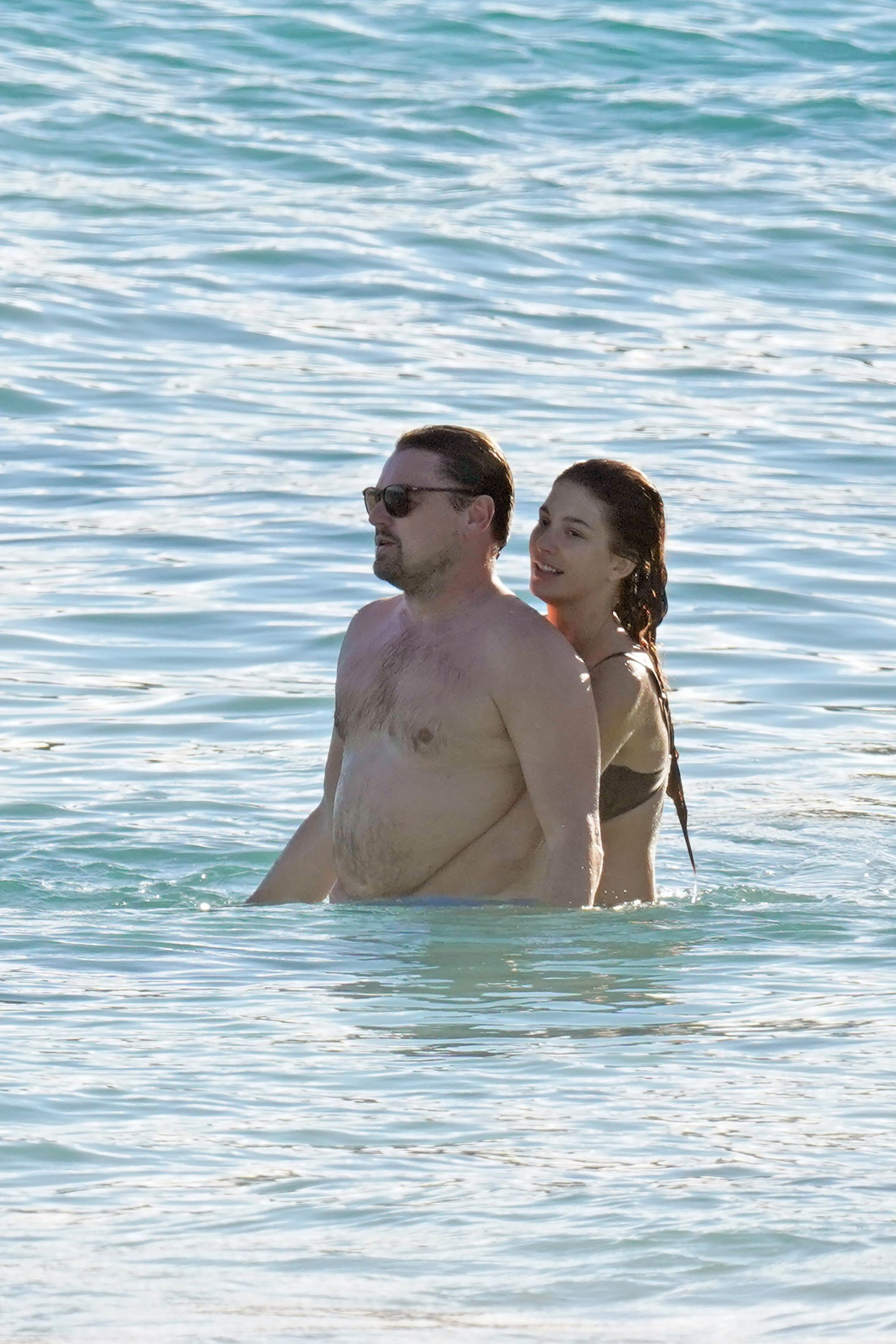 Leonardo DiCaprio and Camila Morrone splash around in the ocean