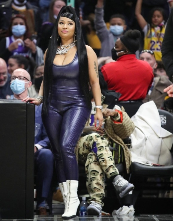 The rapper was clearly supporting the Lakers wearing the team's purple