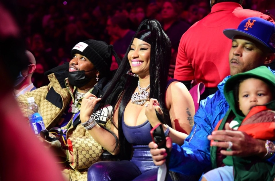 The rapper sat next to hubby Kenneth Petty and their 16-month-old son