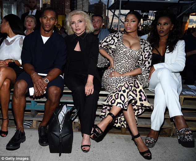 VIP: The rapper hand a front row seat next to (L-R) Victor Cruz, Debbie Harry, and June Ambrose