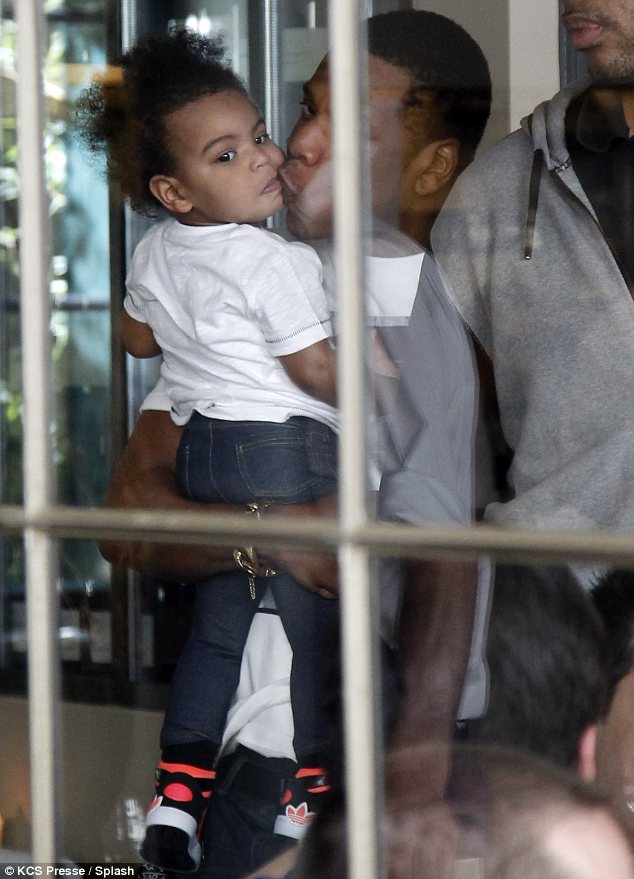 Sealed with a kiss: Jay-Z was seen planting a tender kiss on the little one's cheek