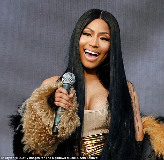 On the mic: Hairstylist Kendall Dorsey coiffed the knee-length raven wig of Nicki (born Onika Maraj), whose fully-contoured make-up was applied by Mali Magic