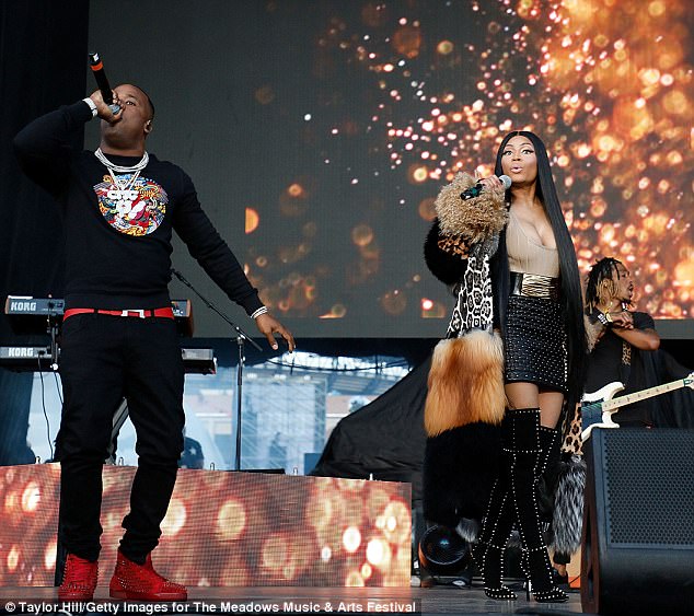 Stealing the stage! The Superbass diva crashed Future's headlining set on the Citi Field mainstage to spit her Rake It Up verse alongside Yo Gotti 