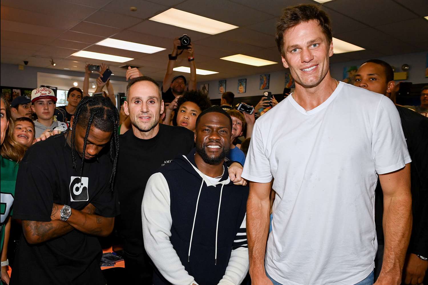 Tom Brady Makes Surprise Visit to Trading Card Store with Kevin Hart,  Travis Scott