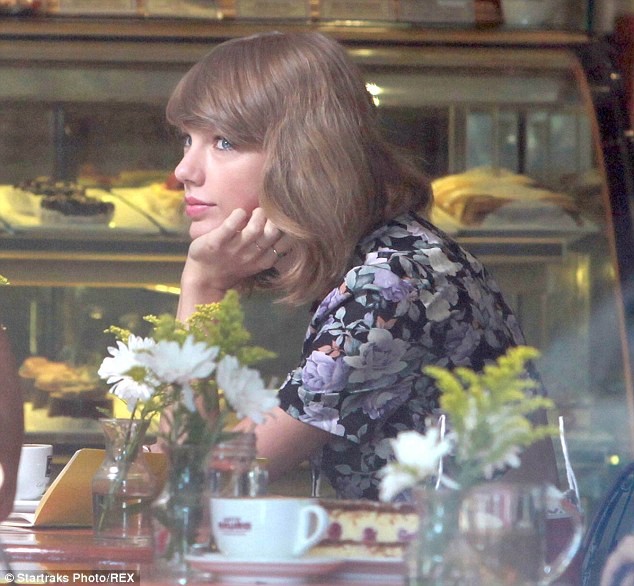 In her element? The star's blue eyes shone as she sat in the delicious looking cafe which was filled with pastries and daisies and coffees